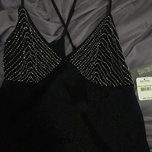 Black beaded slip tags still on